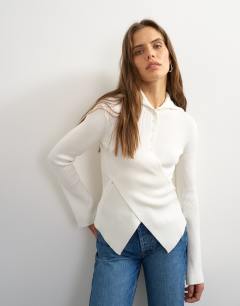 Model wearing Knitted asymmetric shawl collar jumper in ivory