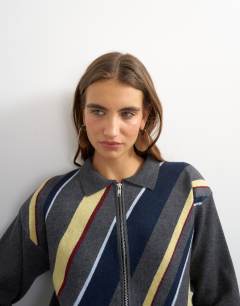 Model wearing Knitted asymmetric stripe jacket in grey multi