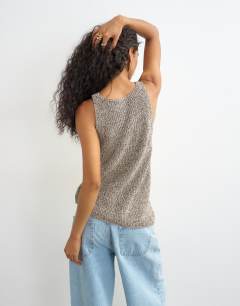 Model wearing Knitted asymmetric vest in khaki