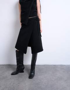 Model wearing Knitted asymmetric wrap skirt co-ord in black