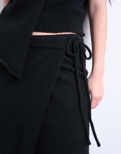 Model wearing Knitted asymmetric wrap skirt co-ord in black