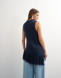 Model wearing Knitted asymmetrical fringe tunic in navy