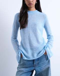 Model wearing Knitted back cut out top in blue