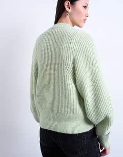 Model wearing Knitted balloon sleeve jumper in mint