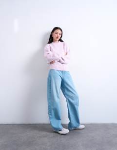 Model wearing Knitted balloon sleeve jumper in vailed pink