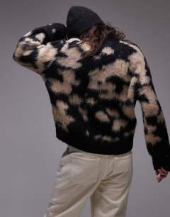 Model wearing Knitted blur brushed floral animal oversized jumper in neutral