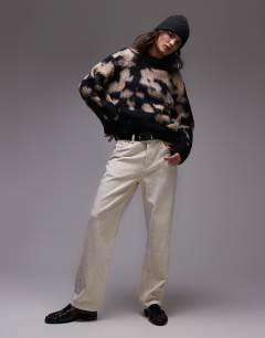 Model wearing Knitted blur brushed floral animal oversized jumper in neutral
