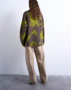 Model wearing Knitted blurred floral jumper in green