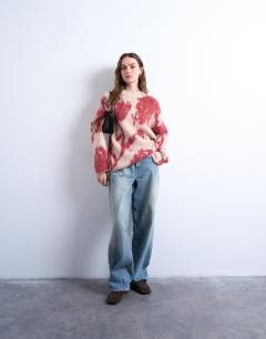 Model wearing Knitted blurred floral jumper in pink