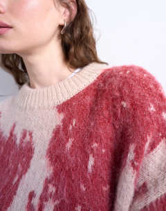 Model wearing Knitted blurred floral jumper in pink