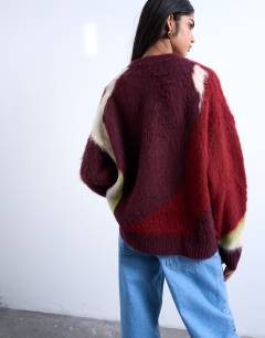 Model wearing Knitted blurred flower jumper in burgundy