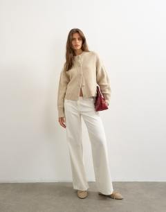 Model wearing Knitted boxy deep rib cardigan in latte