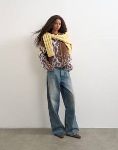 Model wearing Knitted boxy floral cardigan in multi