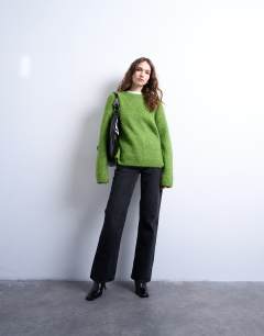 Model wearing Knitted boxy fluffy crew jumper in green