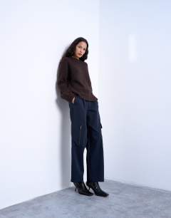 Model wearing Knitted boxy fluffy crew neck jumper in chocolate