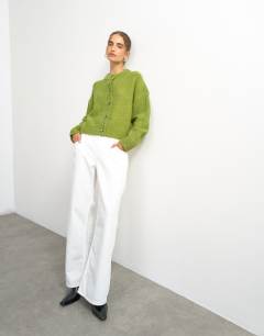 Model wearing Knitted boxy pointelle deep rib cardigan in green