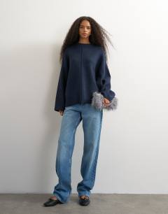 Model wearing Knitted boxy wide sleeve button detail jumper in navy