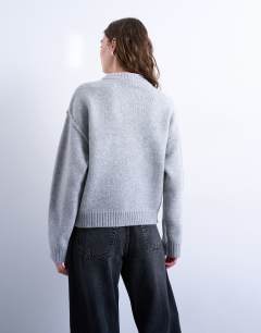 Model wearing Knitted boxy wide sleeve mid crew jumper in grey