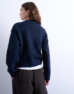 Model wearing Knitted boxy wide sleeve mid crew jumper in Navy