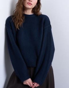 Model wearing Knitted boxy wide sleeve mid crew jumper in Navy