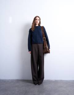 Model wearing Knitted boxy wide sleeve mid crew jumper in Navy