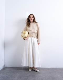Model wearing Knitted boxy wide sleeve mid crew jumper in oat