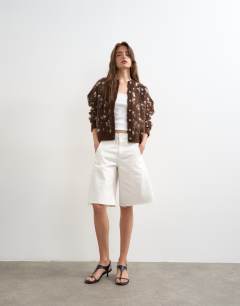 Model wearing Knitted brushed animal cardigan in brown