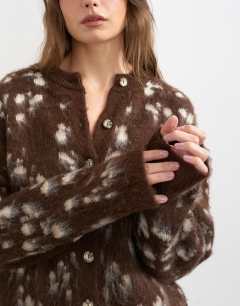 Model wearing Knitted brushed animal cardigan in brown