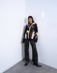 Model wearing Knitted brushed flower jumper in black