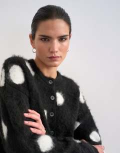 Model wearing Knitted brushed spot cardigan in mono