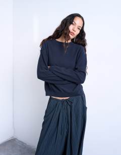 Model wearing Knitted button back jumper in navy