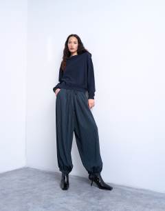 Model wearing Knitted button back jumper in navy