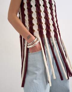 Model wearing Knitted cable tassel tank in burgundy