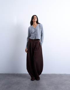 Model wearing Knitted cardigan with shoulder pads in grey