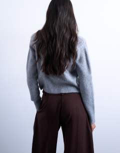Model wearing Knitted cardigan with shoulder pads in grey