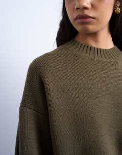 Model wearing Knitted chunky all needle clean crew jumper in khaki