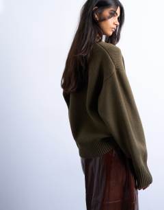 Model wearing Knitted chunky all needle clean crew jumper in khaki