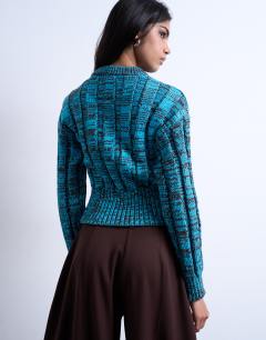 Model wearing Knitted chunky cinch waist twist cardigan in blue and chocolate