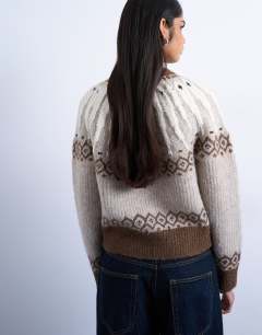 Model wearing Knitted chunky fairisle cardigan in neutral