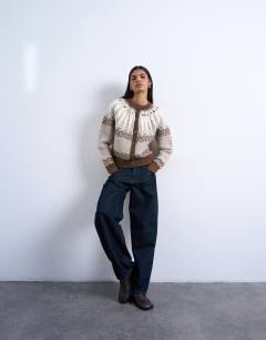 Model wearing Knitted chunky fairisle cardigan in neutral