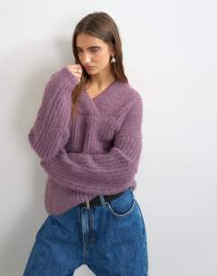 Model wearing Knitted chunky shawl collar jumper in bruised purple