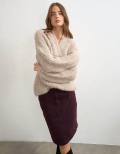 Model wearing Knitted chunky shawl collar jumper in oat