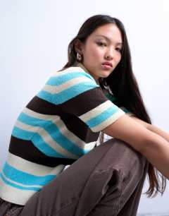 Model wearing Knitted cinched polo top in multi stripe
