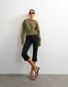 Model wearing Knitted clean cinch waist batwing sleeve jumper in khaki
