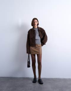 Model wearing Knitted clean cinch waist jumper in grey