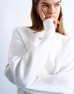 Model wearing Knitted clean cinch waist jumper in ivory