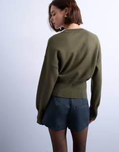 Model wearing Knitted clean cinch waist jumper in khaki