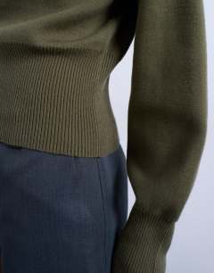 Model wearing Knitted clean cinch waist jumper in khaki