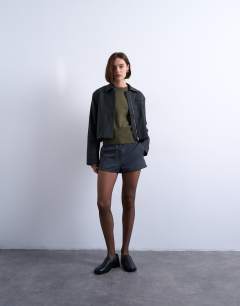 Model wearing Knitted clean cinch waist jumper in khaki