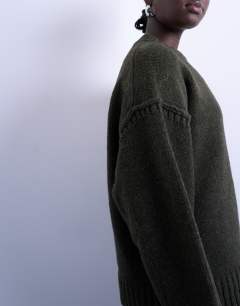 Model wearing Knitted clean exposed seam jumper in khaki